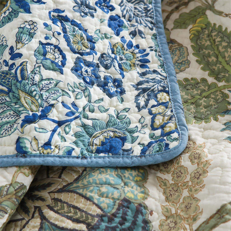 Enchanting Bohemian - Style Quilt Showcasing Intricate Floral Stitching, Complete with Matching Pillowcases