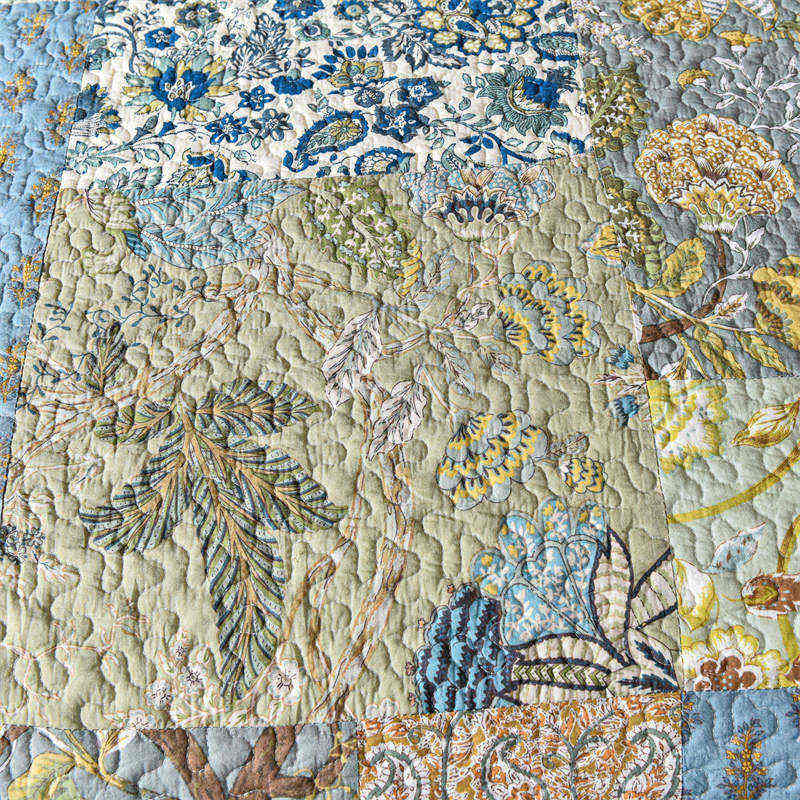 Enchanting Bohemian - Style Quilt Showcasing Intricate Floral Stitching, Complete with Matching Pillowcases