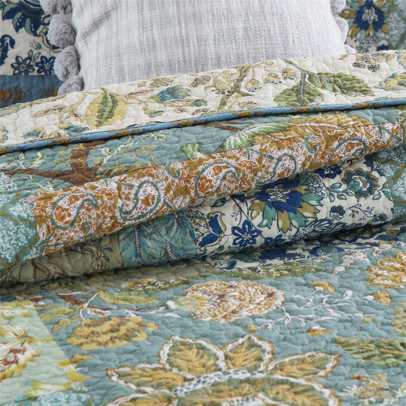 Enchanting Bohemian - Style Quilt Showcasing Intricate Floral Stitching, Complete with Matching Pillowcases