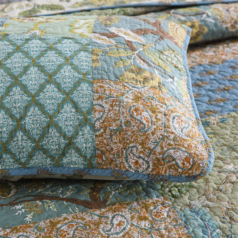 Enchanting Bohemian - Style Quilt Showcasing Intricate Floral Stitching, Complete with Matching Pillowcases